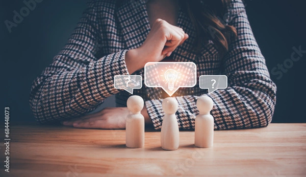 Obraz Businesswoman is thinking with a wooden doll, light bulb and question mark. Creative thinking idea, solution, inspiration, brainstorming, new ideas, imagination, problem solving and innovation concept