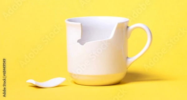 Obraz Broken cup isolated on a solid background