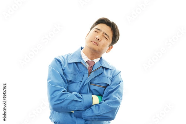 Fototapeta 疲れた表情の作業員