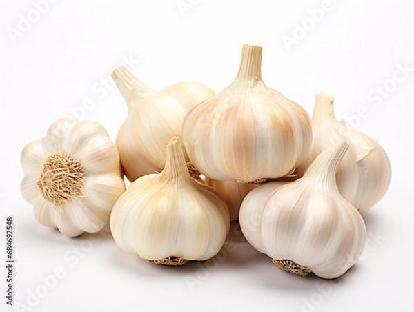 Fototapeta Garlic isolated on plain background. Garlic is widely used in cooking.