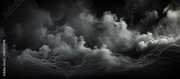 Obraz smokey clouds on a dark black background