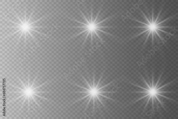 Fototapeta Set of highlights. Flashes of rays of light. The effect of glow, radiance, shine. Collection of various glowing sparks, stars. On a transparent background.