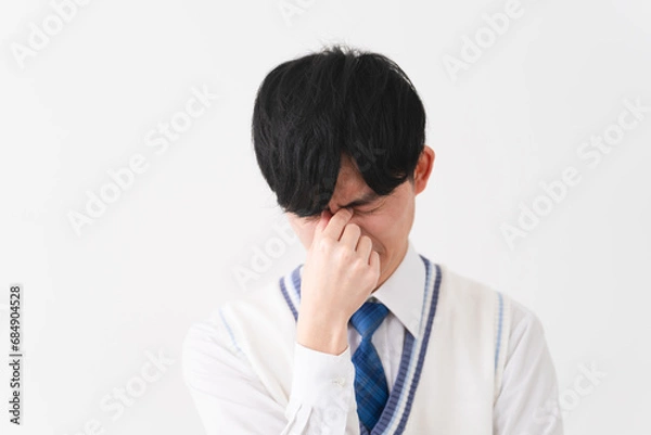 Fototapeta 学生服を着ている若い男性　学生イメージ