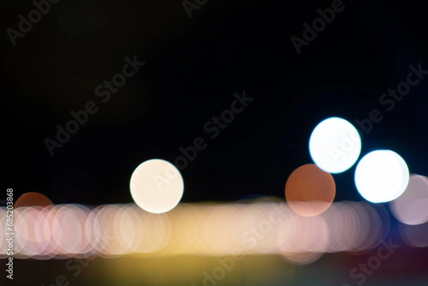 Fototapeta bokeh background on dark background.