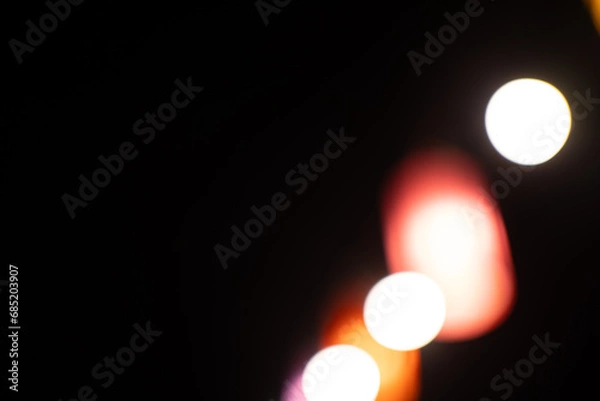 Fototapeta bokeh background on dark background.
