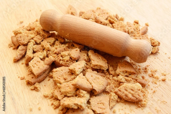 Obraz Crushing digestive biscuits with a rolling pin