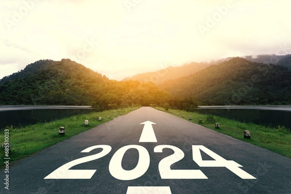 Fototapeta The new year 2024 or straightforward concept. Text 2024 written on the asphalt road at sunset. planning and challenge, business strategy, opportunity, hope, new life, and sustainability environment.
