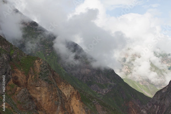 Fototapeta Spectacular and amazing beautiful panorama of the Andes Mountains in the Colca Canyon, Peru. White clouds, wonderful cloudscape. Cliff, blue sky. HDR