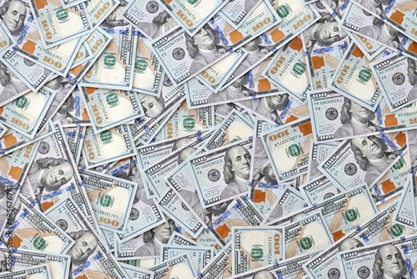 Fototapeta Very big amount of US hundred dollar bills close up. Huge quantity of united states currency notes on flat table