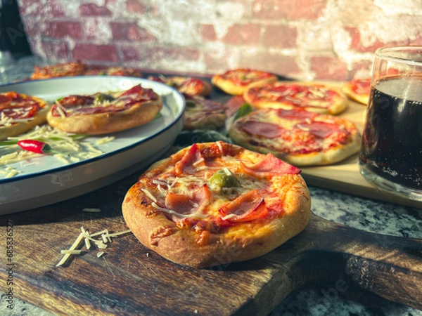 Obraz Small pepperoni pizza in a party table