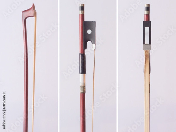 Fototapeta Classical violin bow on white background from different sides
