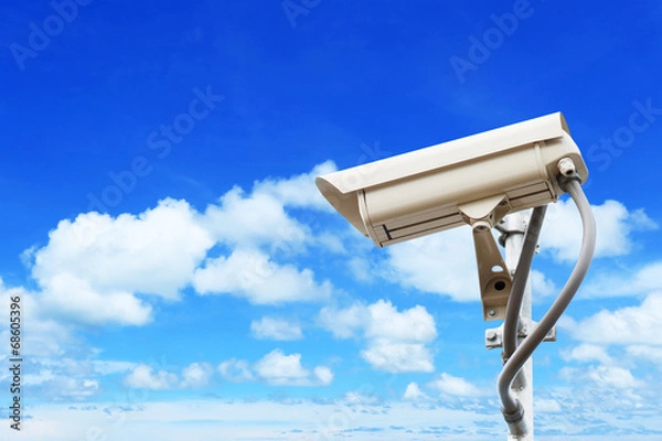 Obraz Security camera on blue sky background