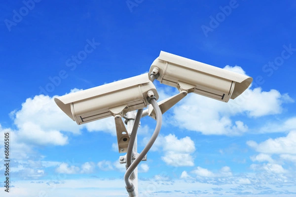 Obraz Security camera on blue sky background