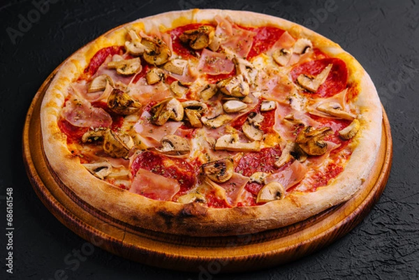 Obraz pizza with ham, salami and mushrooms