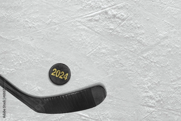 Obraz Hockey stick and puck on ice arena