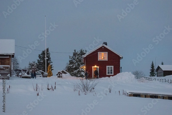 Obraz JUKKASJARVI, SWEDEN - NOVEMBER 26 2023: Christmas market in the old village near Kiruna in Jukkasjarvi.