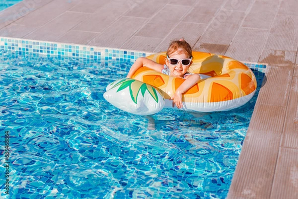 Obraz Little girl having fun in swimming pool.