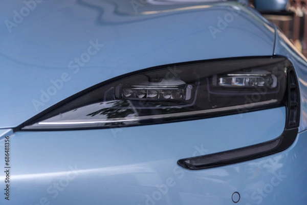 Fototapeta Nakhonpathom,Thailand - 1 Dec, 2023: Closeup to headlight of BYD Seal test drive car show