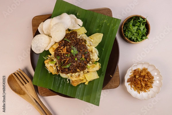 Obraz Tahu Tek is an Indonesian Street Food From Surabaya, East Java. Made From Tofu, Eggs, Bean Sprouts, Rice Cake, Potatoes, and Peanut Sauce Mixed with Petis (shrimp Sauce).