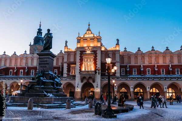 Obraz Krakow Christmas Market Square - before the sunset. Beautiful Sukiennice (Cloth Hall) and Adam Mickiewicz sculpture