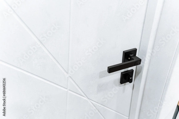 Fototapeta Black Color Door Handle With Lock, Modern Design Apartment Door Handles, Closed Door Close-Up.