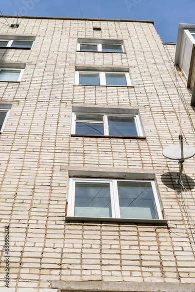Obraz Lots of windows in the house. Rectangular, white. Brick white wall.