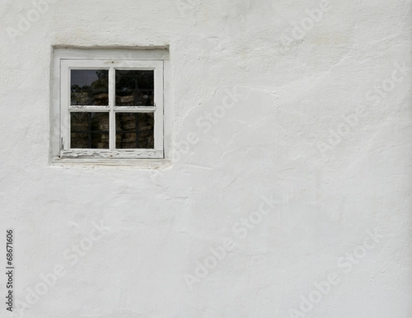 Obraz The old white plastered wall with a small window