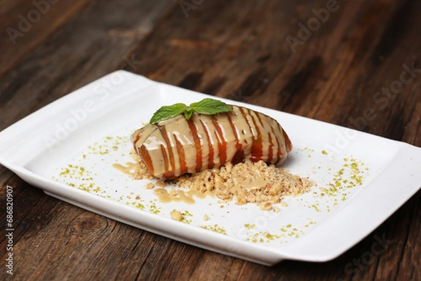 Obraz Pumpkin dessert with tahini and hazelnuts