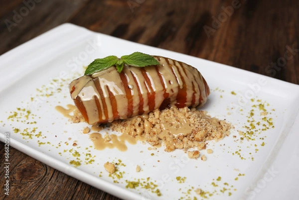 Obraz Pumpkin dessert with tahini and hazelnuts