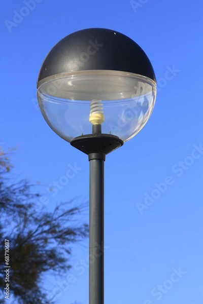 Fototapeta spherical lamp with energy saving light bulb