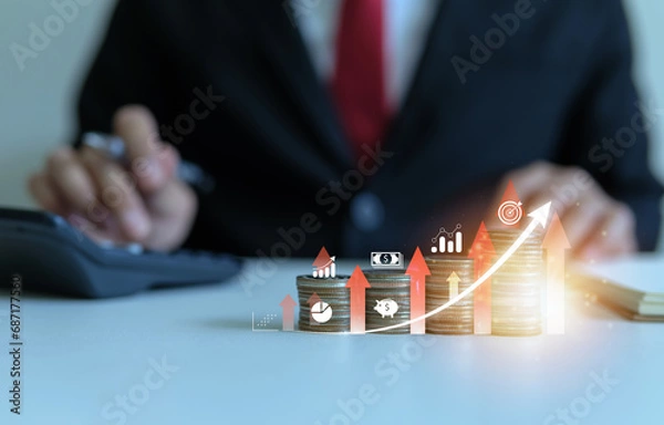 Fototapeta Profitable investment concept, businessman using calculator to calculate returns, stack of coins with gradient from least to highest and arrow going up.