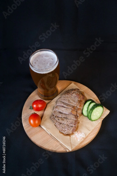Obraz Fried meat with green vegetables with a glass of beer