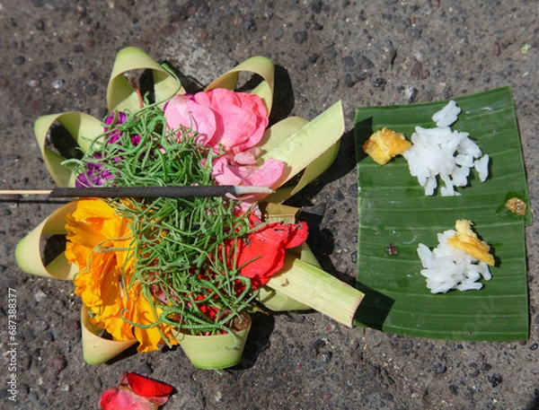 Fototapeta Balinese Canang Sari offerings to the Gods on a beach in Bali