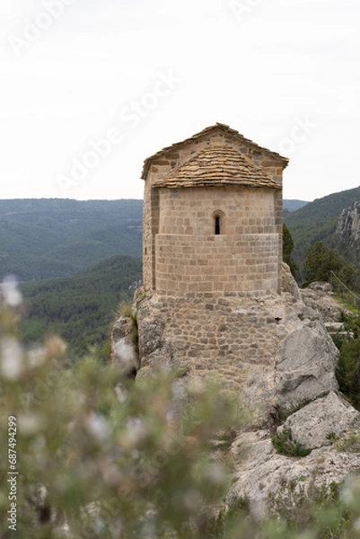 Fototapeta Amazing view of Ermita de La Pertusa above the lake in Congost de Mont Rebei.