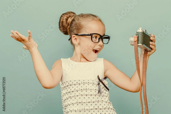 Obraz  smiling child  holding a  camera