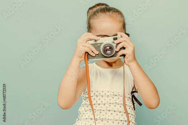 Obraz  smiling child  holding a  camera