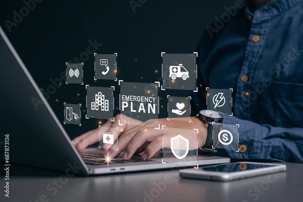Fototapeta Businessman using a computer to Emergency Plan icon to learn and prepare in emergency situation .Business Evacuation Training concept. Concept of Emergency Preparedness Plan