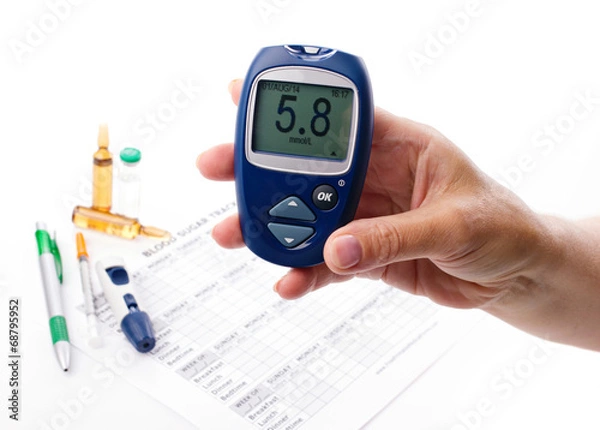 Fototapeta glucometer in woman's hand