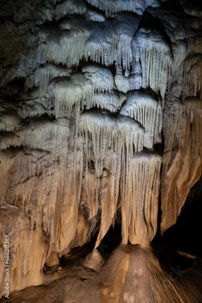 Obraz Bear Cave, amazing view of stalactites and stalagnites in colorful bright light, beautiful natural landmark in touristic place.in the Sudety Mountains. Poland