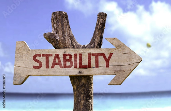Obraz Stability wooden sign with a beach on background