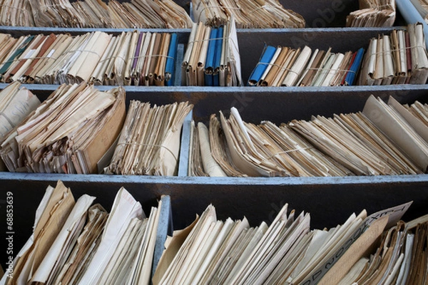 Obraz shelves full of files in a messy old-fashioned archive