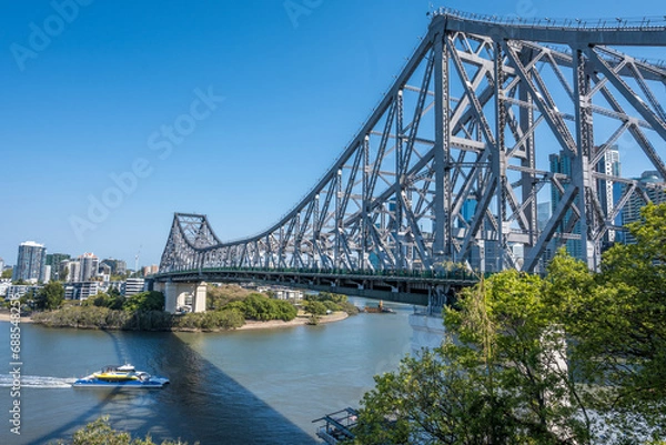 Fototapeta Ferry going under Story Bridge in Brisbane, Australia.