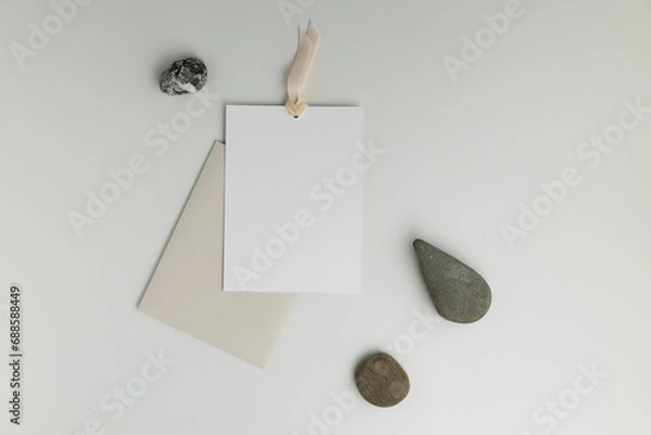 Obraz A composition with stones and an envelope with a postcard