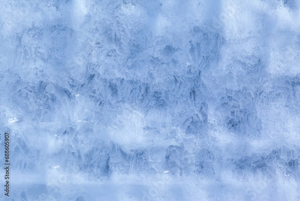 Fototapeta Texture of winter ice on a stone cliff. Blue natural ice background