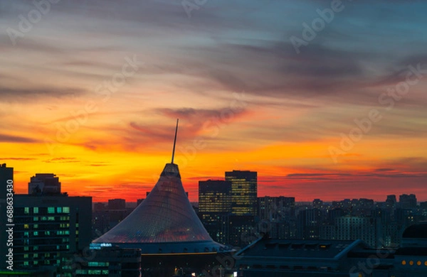 Obraz Astana, Kazakhstan, November 2023. View of the Khan-Shatyr shopping center against the backdrop of sunset.