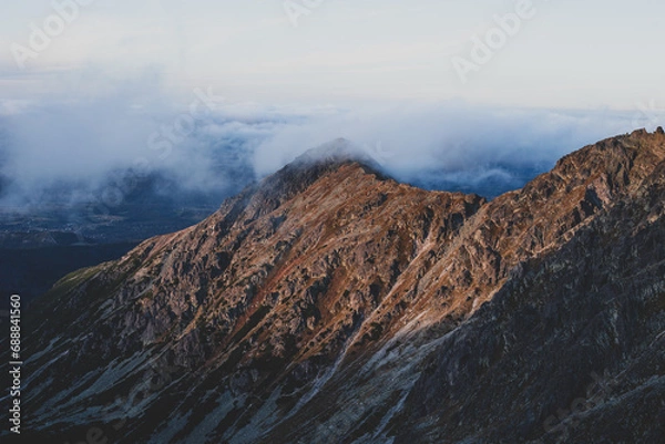 Fototapeta Mountain in the clouds.