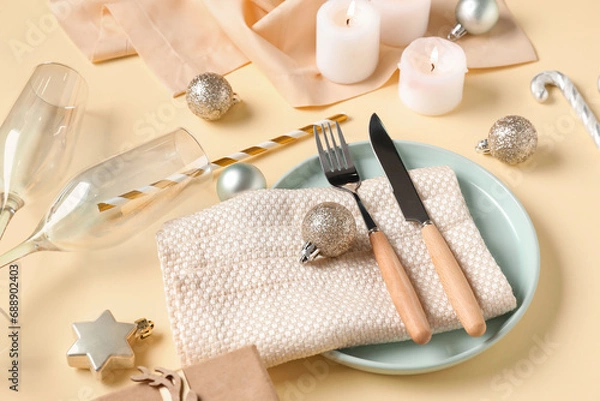 Fototapeta Beautiful table setting for Christmas dinner with decorations on yellow background