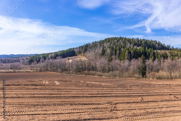 Fototapeta Field with soil in the country at spring