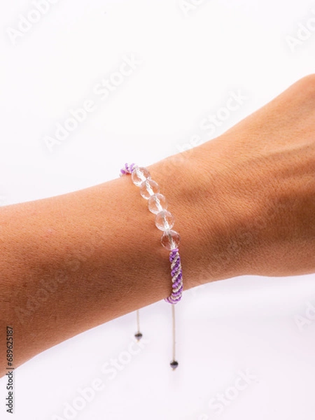 Fototapeta Woman hand with bracelets show thumb up symbol isolated on white background ,clipping path included for design.