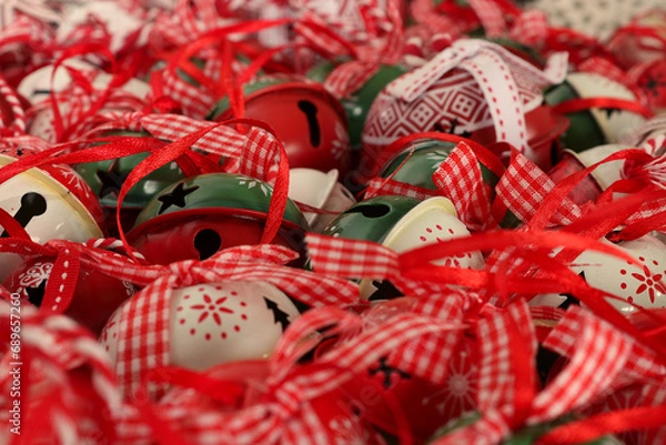 Fototapeta Shallow depth of field image of crotal bells or sleigh bells with focus on the bottom left third, The green  and red bell. Magical Christmas image.